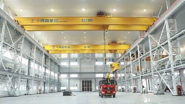 under rotating bridge mounted cranes